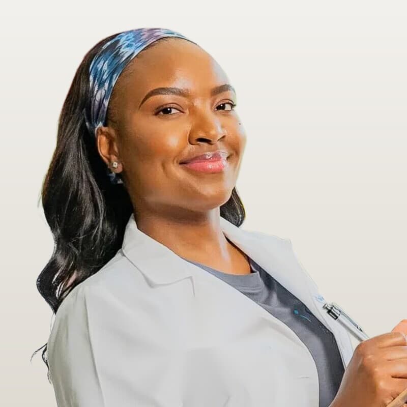 Jheanelle Bailey, licensed nurse and founder of Iso IV Hydration, in an Iso IV white coat